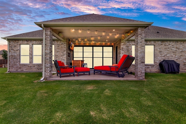 288 Ontario Loop, Sunnyvale, TX 75182 - back of house with a patio area, a shingled roof, a yard, brick siding, and an outdoor living space