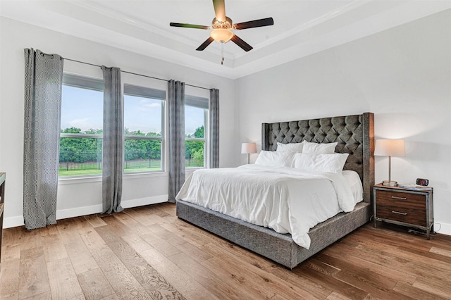 288 Ontario Loop, Sunnyvale, TX 75182 - bedroom featuring wood-type flooring, a raised ceiling, crown molding, baseboards, and ceiling fan