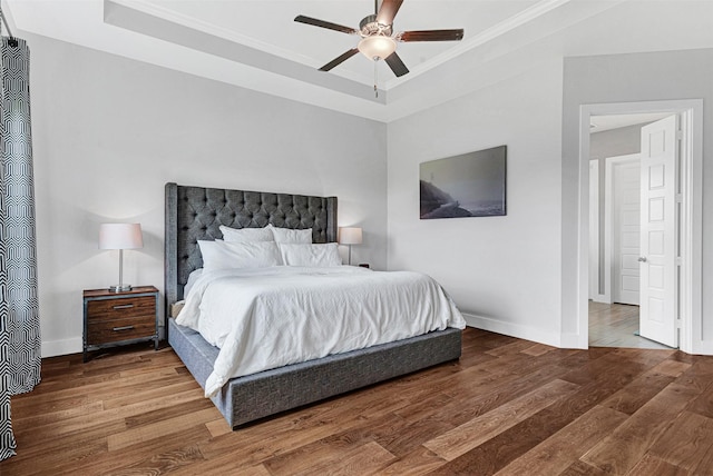 288 Ontario Loop, Sunnyvale, TX 75182 - bedroom featuring wood finished floors, a tray ceiling, crown molding, baseboards, and a ceiling fan
