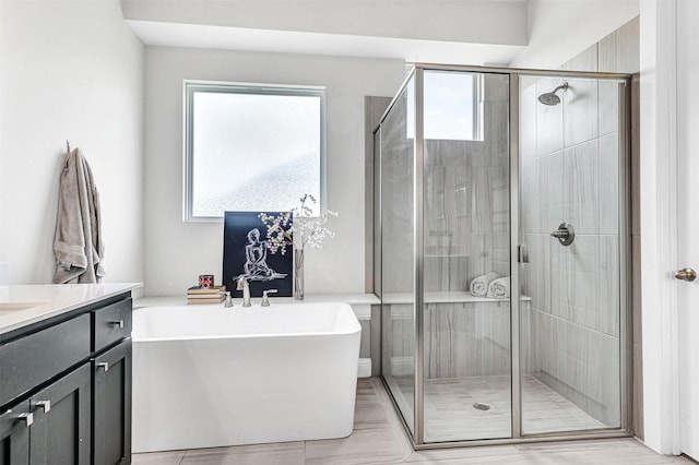288 Ontario Loop, Sunnyvale, TX 75182 - full bath featuring a freestanding tub, a shower stall, and vanity