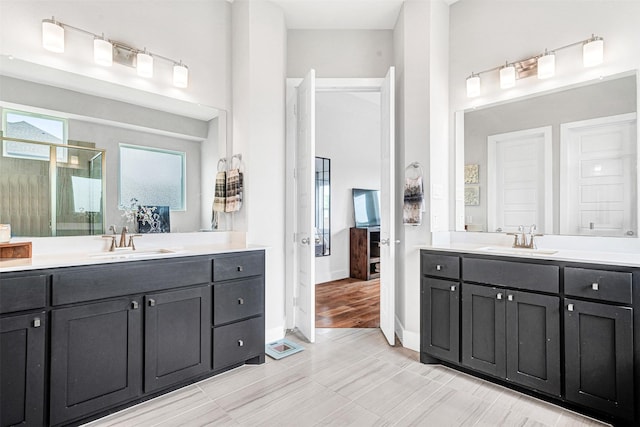 288 Ontario Loop, Sunnyvale, TX 75182 - full bathroom with a stall shower, two vanities, and baseboards