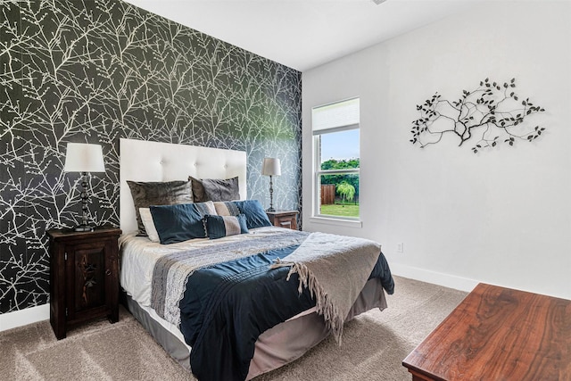 288 Ontario Loop, Sunnyvale, TX 75182 - bedroom with wallpapered walls, an accent wall, light colored carpet, and baseboards