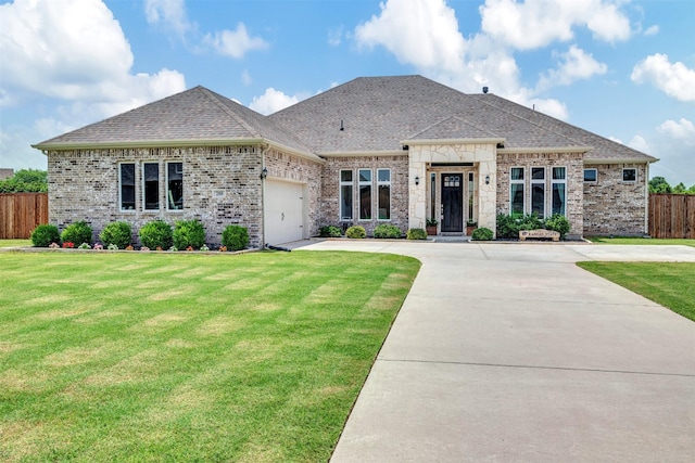 288 Ontario Loop, Sunnyvale, TX 75182 - french country style house with an attached garage, concrete driveway, roof with shingles, and brick siding