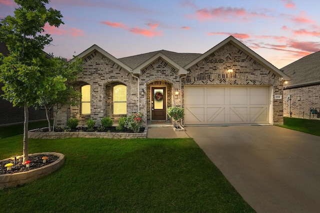 6105 Hightower St, Celina, TX 76227 - french provincial home with driveway, a lawn, a garage, and brick siding