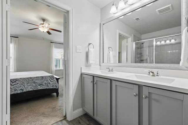 6105 Hightower St, Celina, TX 76227 - ensuite bathroom featuring a shower stall, double vanity, a ceiling fan, wood finished floors, and baseboards