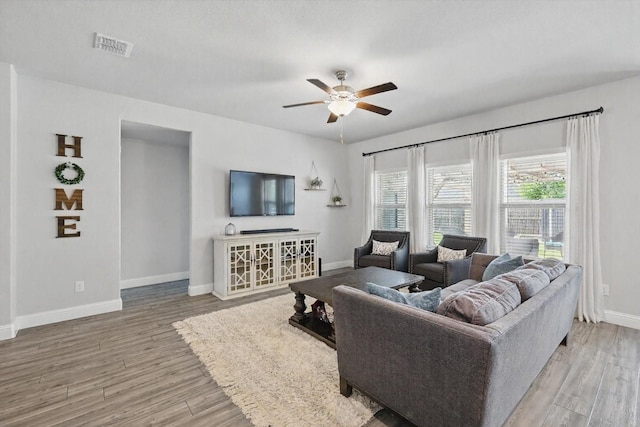 6105 Hightower St, Celina, TX 76227 - living area featuring a ceiling fan, baseboards, and light wood finished floors