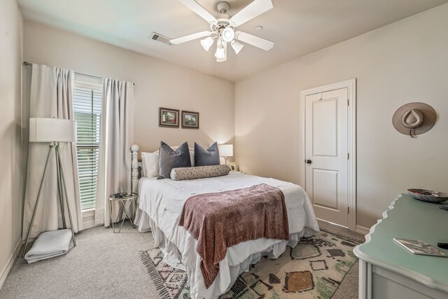 1910 Hope St Unit 15, Dallas, TX 75206 - bedroom with light colored carpet and ceiling fan