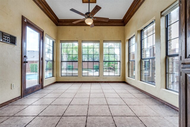 1541 Croston Dr, Plano, TX 75075 - unfurnished sunroom featuring crown molding, healthy amount of natural light, a textured wall, a textured ceiling, and baseboards