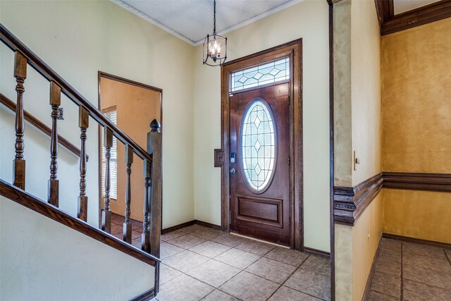 1541 Croston Dr, Plano, TX 75075 - foyer featuring ornamental molding, a chandelier, stairway, baseboards, and tile patterned flooring