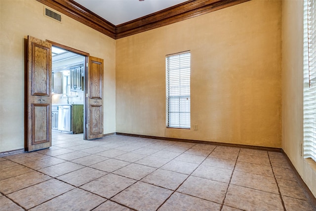 1541 Croston Dr, Plano, TX 75075 - spare room featuring crown molding, light tile patterned floors, a towering ceiling, and baseboards