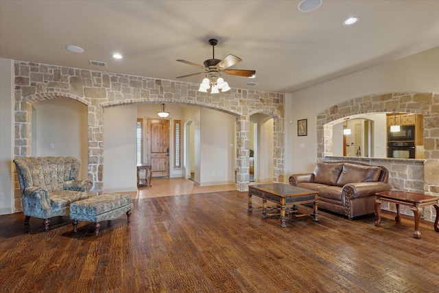6708 Mustang Trl, Sanger, TX 76266 - living room with arched walkways, a ceiling fan, wood finished floors, and recessed lighting