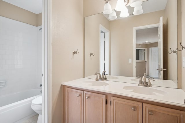 10120 Preston Vineyard Dr, Frisco, TX 75035 - bathroom with double vanity, toilet, a chandelier, and tub / shower combination