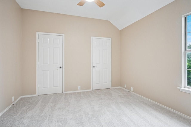 10120 Preston Vineyard Dr, Frisco, TX 75035 - unfurnished bedroom featuring light colored carpet, multiple windows, lofted ceiling, and baseboards