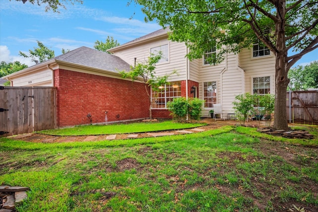 10120 Preston Vineyard Dr, Frisco, TX 75035 - back of house featuring brick siding, an attached garage, and a shingled roof