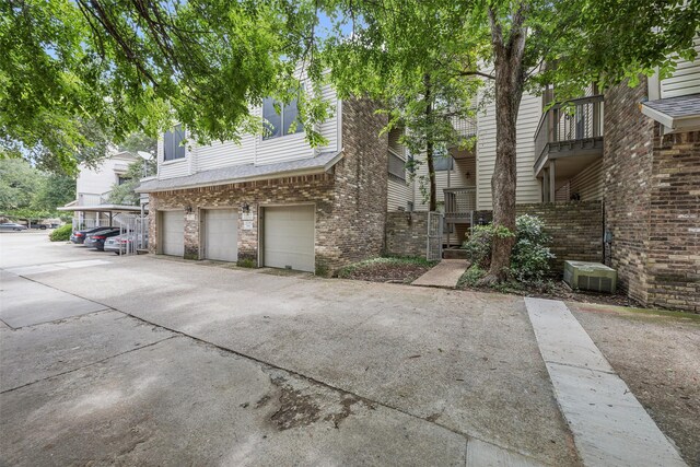 7340 Skillman St Unit 1207, Dallas, TX 75231 - multi unit property with brick siding and a garage