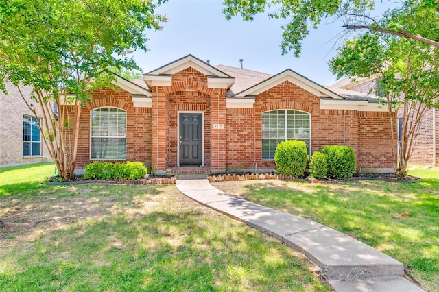 1117 Red Hawk Dr, Frisco, TX 75033 - traditional home featuring brick siding and a front yard