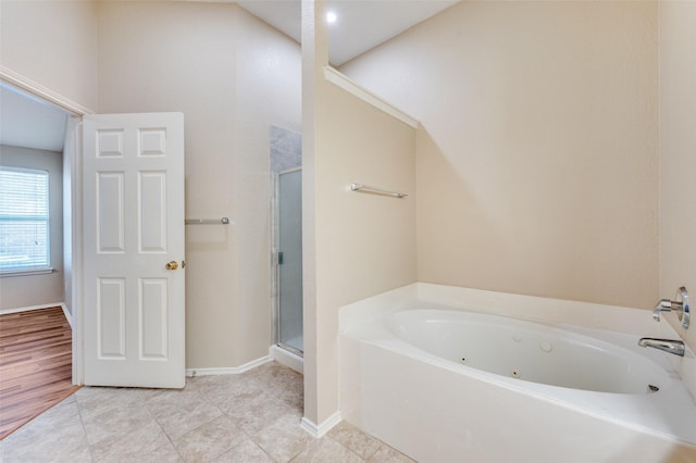 1117 Red Hawk Dr, Frisco, TX 75033 - full bath featuring a tub with jets, a shower stall, tile patterned floors, and baseboards