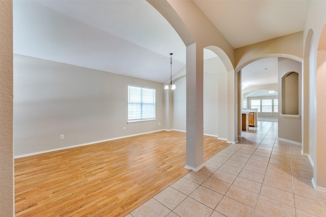 1117 Red Hawk Dr, Frisco, TX 75033 - spare room with arched walkways, healthy amount of natural light, lofted ceiling, and baseboards