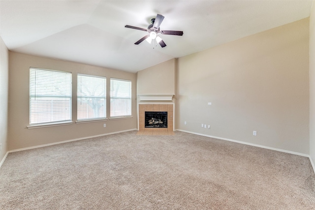 1117 Red Hawk Dr, Frisco, TX 75033 - unfurnished living room with a tile fireplace, carpet floors, ceiling fan, lofted ceiling, and baseboards