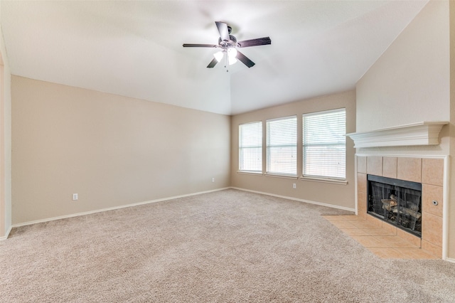 1117 Red Hawk Dr, Frisco, TX 75033 - unfurnished living room featuring carpet floors, a tile fireplace, and a ceiling fan