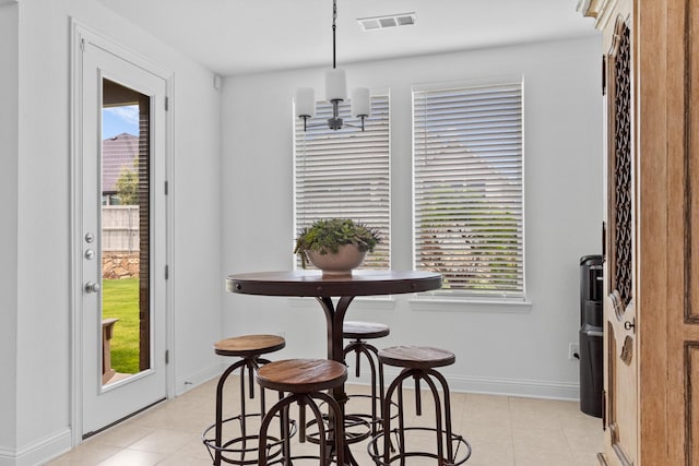 2788 Walker Way, Northlake, TX 76247 - dining space featuring light tile patterned flooring, a chandelier, and baseboards
