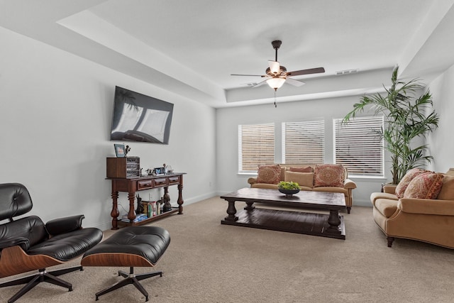 2788 Walker Way, Northlake, TX 76247 - carpeted living area featuring ceiling fan, baseboards, and a tray ceiling