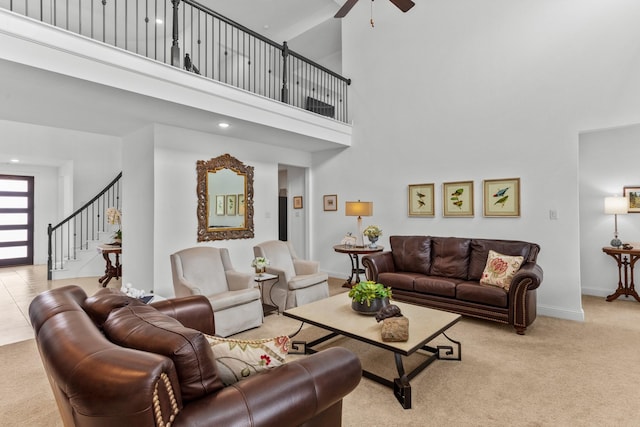 2788 Walker Way, Northlake, TX 76247 - living area with ceiling fan, light carpet, stairway, a high ceiling, and baseboards