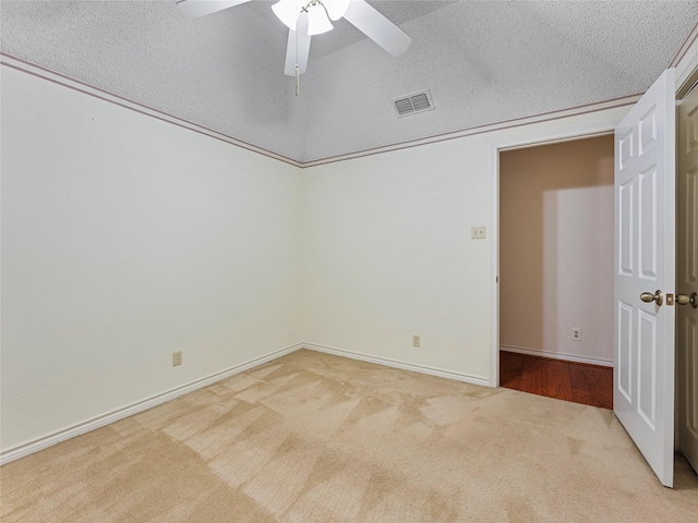 211 Indian Trace Ln, Waxahachie, TX 75165 - empty room featuring carpet, ceiling fan, baseboards, and a textured ceiling