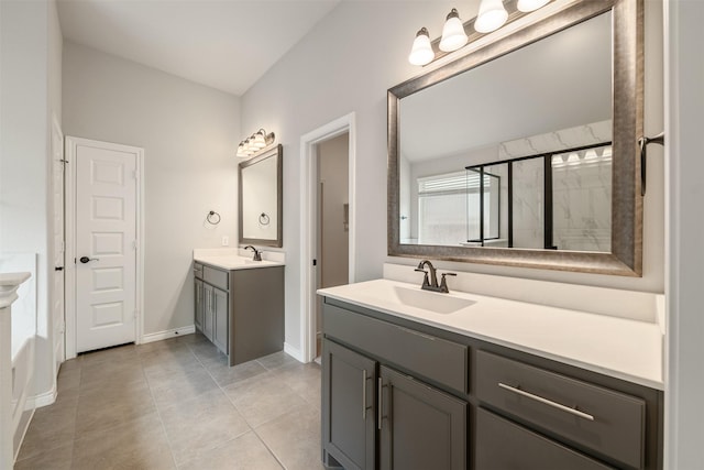 2627 Askern Ct, Grand Prairie, TX 75052 - bathroom with two vanities, tile patterned flooring, baseboards, and a shower