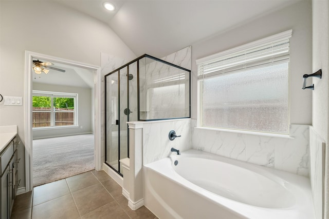 2627 Askern Ct, Grand Prairie, TX 75052 - bathroom with vanity, a garden tub, vaulted ceiling, a stall shower, and tile patterned floors