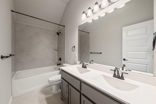 2627 Askern Ct, Grand Prairie, TX 75052 - full bathroom featuring toilet, double vanity, washtub / shower combination, and tile patterned floors