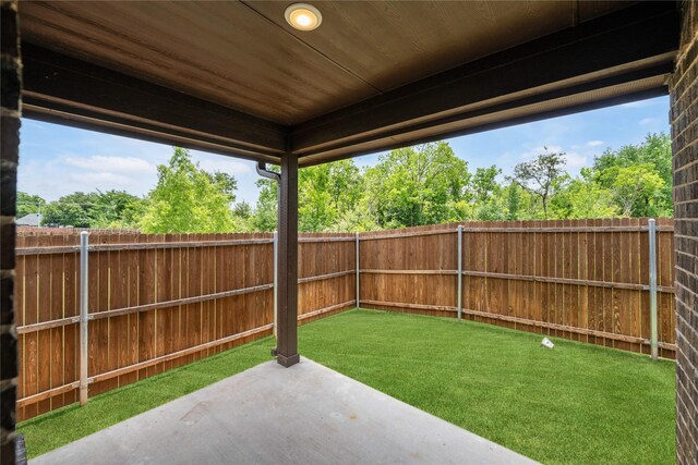 2627 Askern Ct, Grand Prairie, TX 75052 - fenced backyard with a patio area