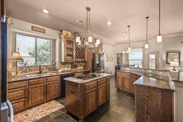 217 Silver Rose Blvd, Burleson, TX 76028 - kitchen with black appliances, a chandelier, a spacious island, a sink, and plenty of natural light