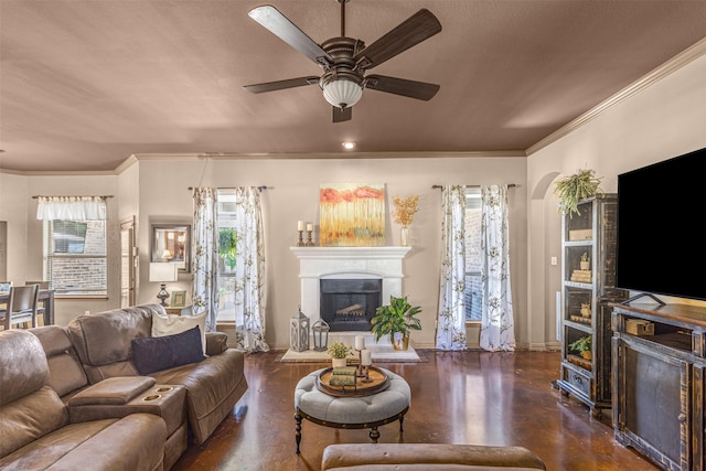 217 Silver Rose Blvd, Burleson, TX 76028 - living room with a fireplace with raised hearth, a ceiling fan, ornamental molding, and baseboards