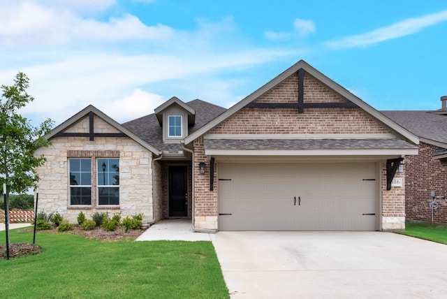 616 Juneau St, Gainesville, TX 76240 - view of front facade with stone siding, an attached garage, concrete driveway, roof with shingles, and a front yard
