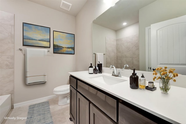 616 Juneau St, Gainesville, TX 76240 - bathroom with vanity, toilet, tile patterned floors, and baseboards