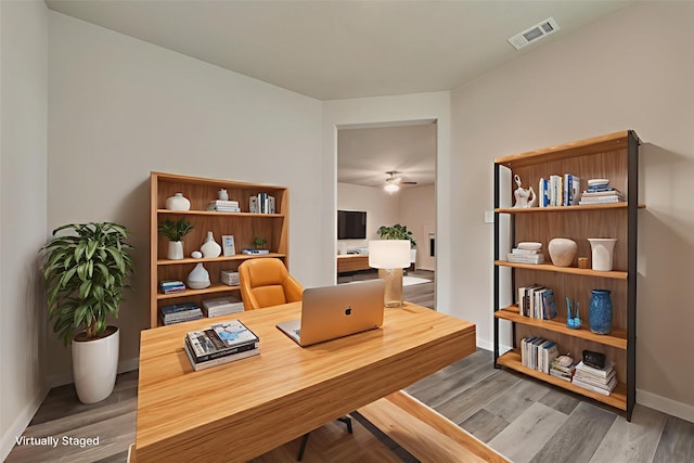 616 Juneau St, Gainesville, TX 76240 - office featuring baseboards, a ceiling fan, and wood finished floors
