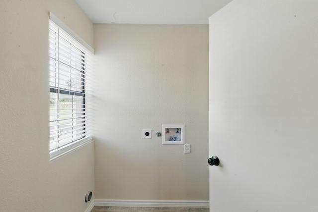 11720 Lavender Ave, Azle, TX 76020 - laundry area featuring plenty of natural light, hookup for an electric dryer, hookup for a washing machine, and baseboards