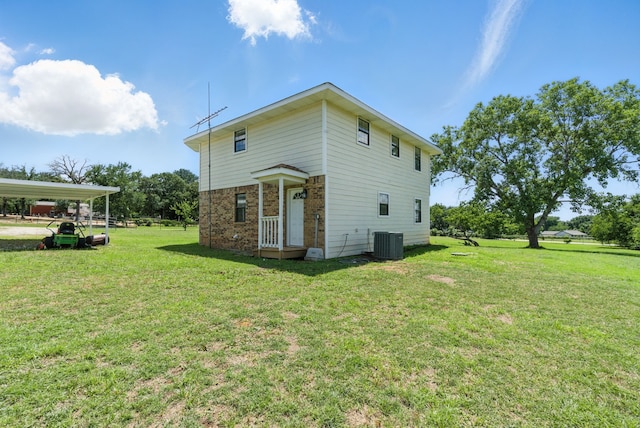 11720 Lavender Ave, Azle, TX 76020 - rear view of house featuring brick siding, a lawn, central air condition unit, and a detached carport