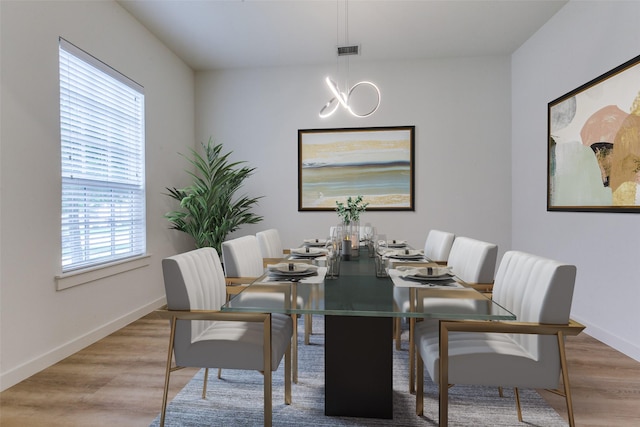 928 Marian Dr, Allen, TX 75013 - dining space with baseboards, wood finished floors, and a chandelier