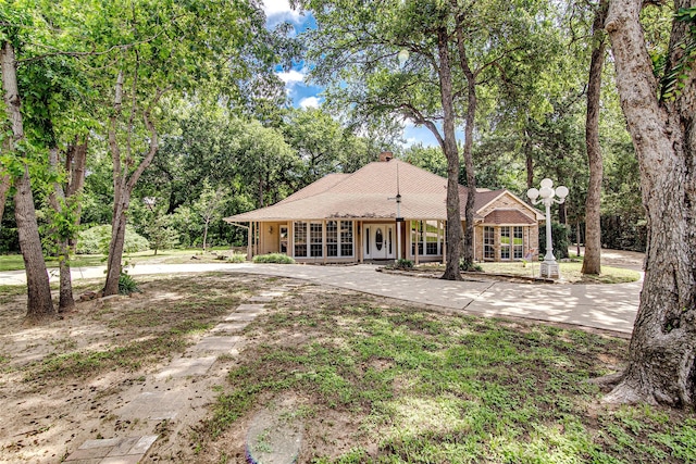 3308 Corn Valley Rd, Grand Prairie, TX 75052 - view of front of property featuring a chimney, french doors, and view of wooded area