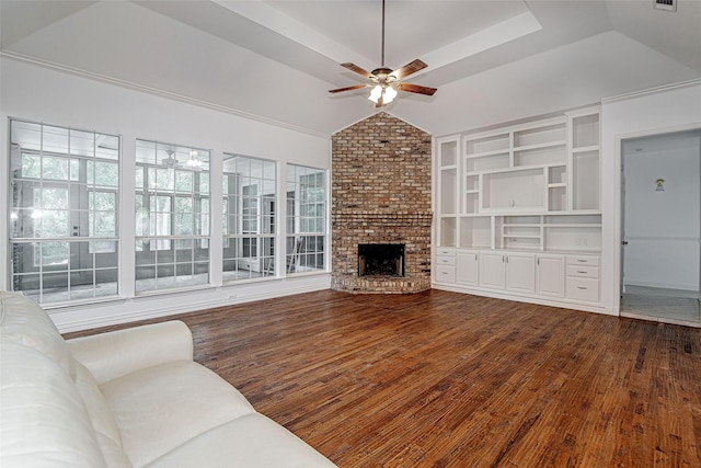 3308 Corn Valley Rd, Grand Prairie, TX 75052 - unfurnished living room featuring ceiling fan, dark wood-style flooring, a brick fireplace, vaulted ceiling, and built in shelves