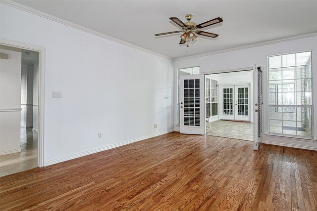 3308 Corn Valley Rd, Grand Prairie, TX 75052 - unfurnished room featuring french doors, ornamental molding, a ceiling fan, baseboards, and wood finished floors