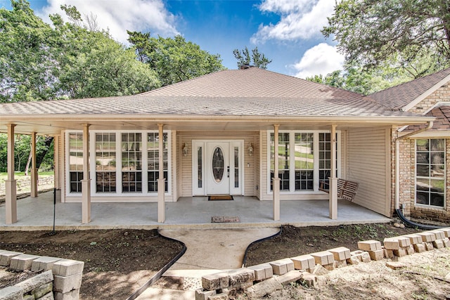 3308 Corn Valley Rd, Grand Prairie, TX 75052 - view of front of house with a shingled roof and covered porch
