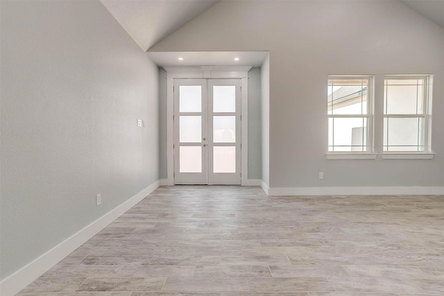 580 Highview Ct, Godley, TX 76044 - foyer entrance with vaulted ceiling, french doors, baseboards, recessed lighting, and light wood-type flooring