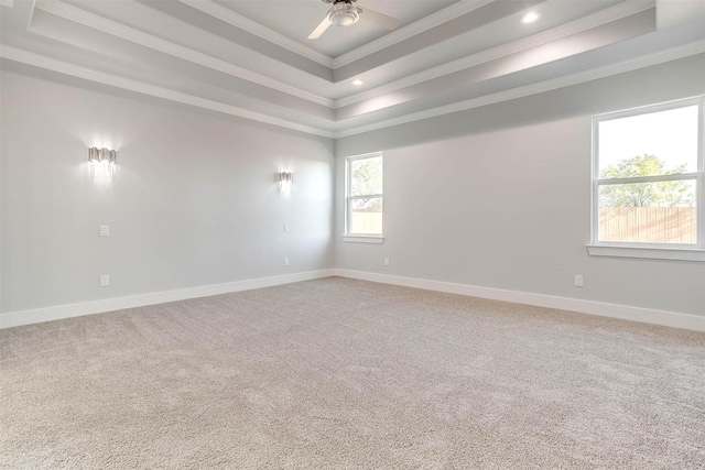 580 Highview Ct, Godley, TX 76044 - unfurnished room with ornamental molding, a raised ceiling, baseboards, ceiling fan, and light colored carpet