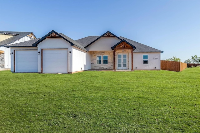 580 Highview Ct, Godley, TX 76044 - view of front facade featuring an attached garage, a shingled roof, and french doors