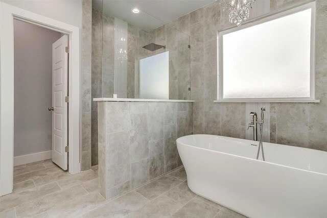580 Highview Ct, Godley, TX 76044 - full bath featuring a walk in shower, a freestanding bath, and tile patterned floors