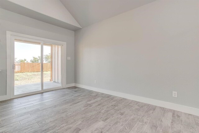 580 Highview Ct, Godley, TX 76044 - unfurnished room with vaulted ceiling, light wood finished floors, and baseboards