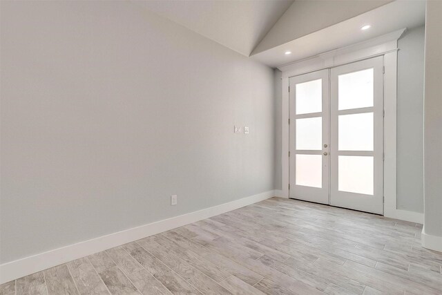 580 Highview Ct, Godley, TX 76044 - spare room with french doors, light wood-type flooring, lofted ceiling, baseboards, and recessed lighting